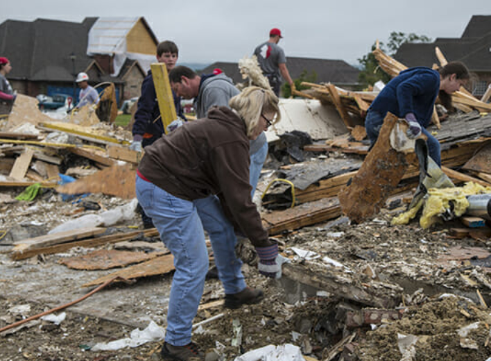 People helping in storm damage